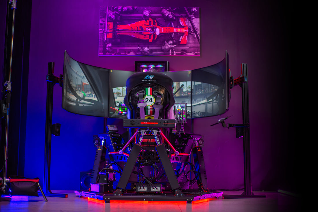 A 6DOF Racing Simulator setup with a Cockpit, Wheelbase, and multiple displays, illuminated by colored lights, positioned on a stage.