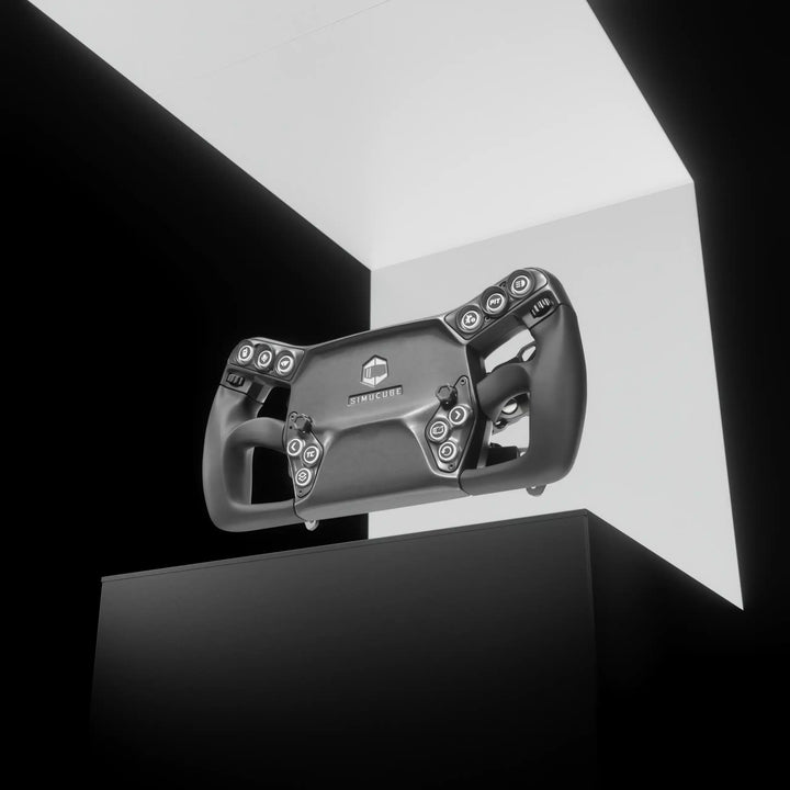 Black gaming steering wheel on a reflective black surface with a white background
