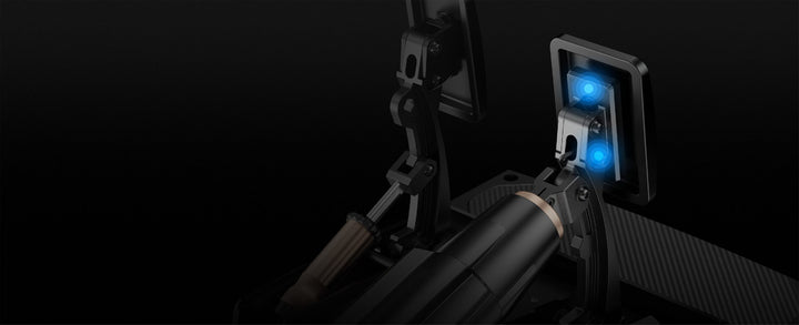 Close-up of a gun with a blue light on a black background